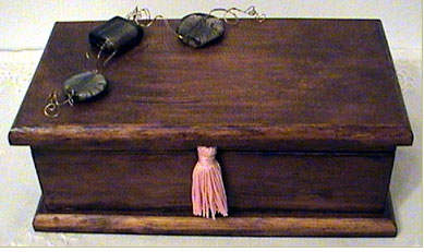 Wooden jewellery box with glass beads and silk tassel